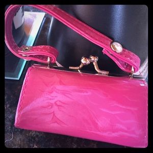 Cute little lipstick purse.  Hot pink in color